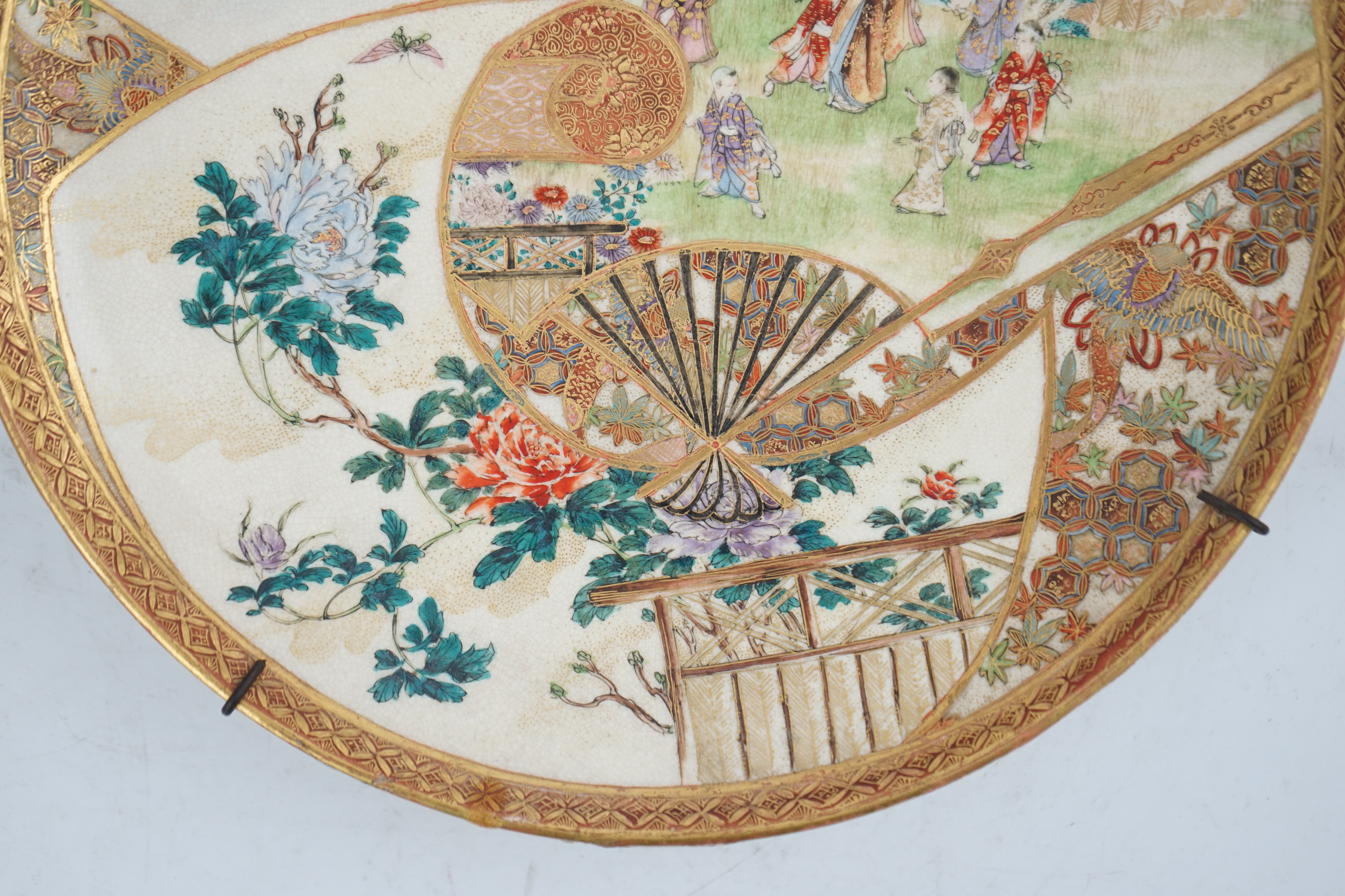 A Japanese Satsuma ‘garden scene’ dish, Meiji period